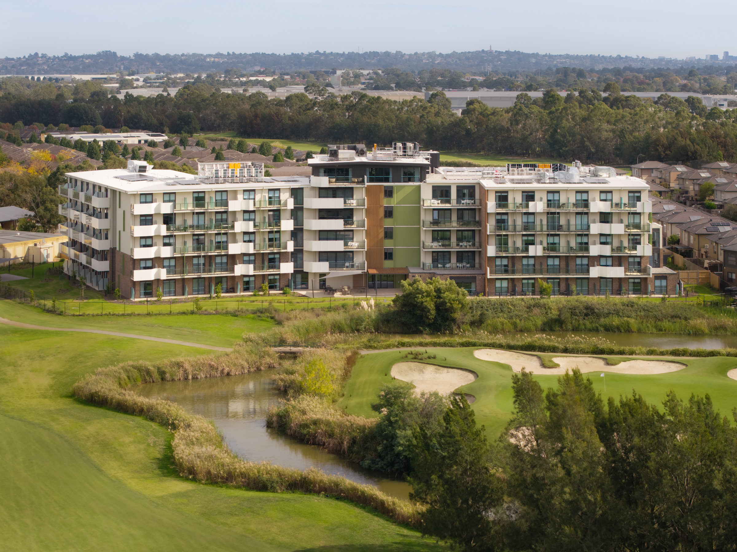 Infin8 Care Knoxfield aged care development overlooking the surrounding golf course in Melbourne