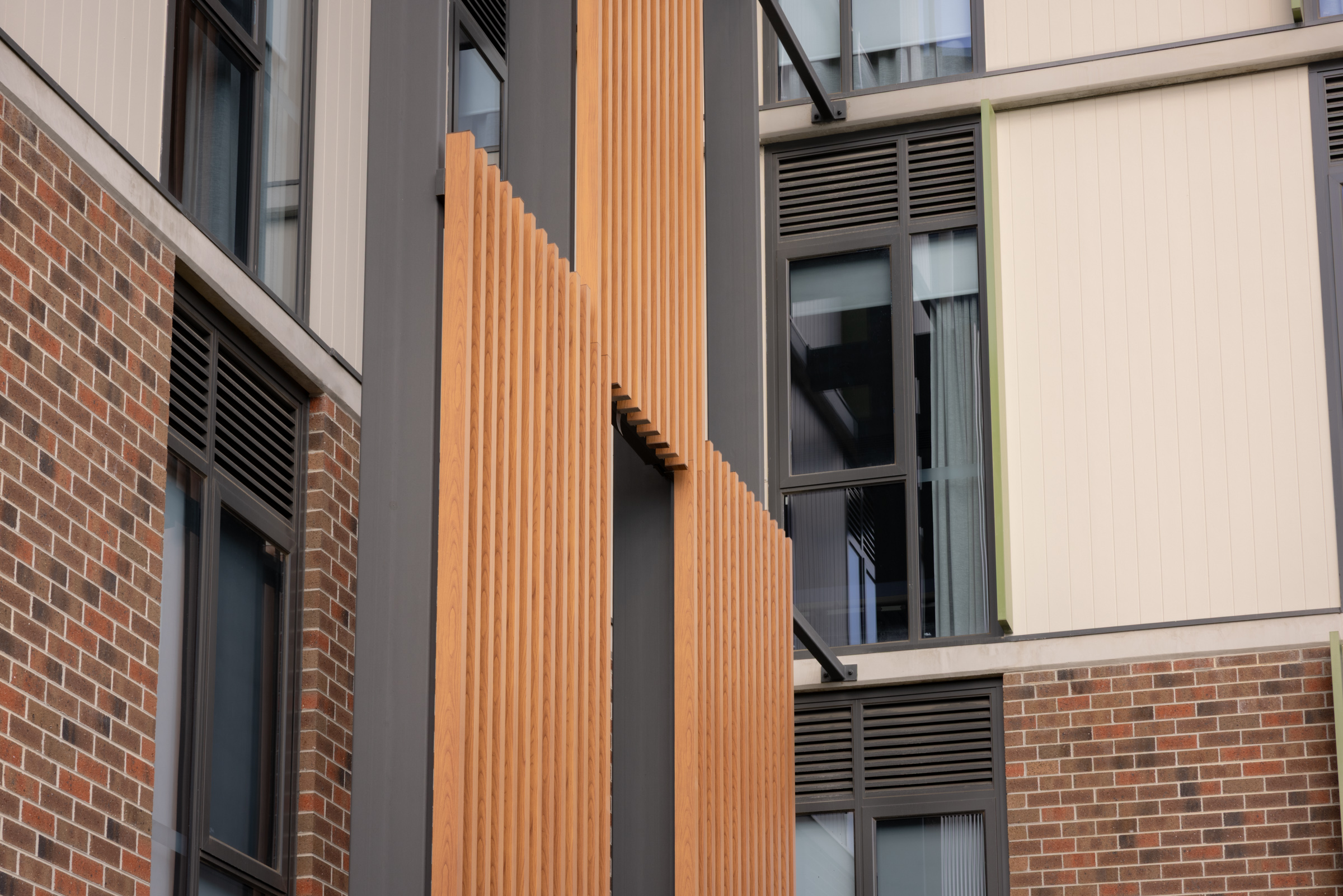Timber screening, brickwork and contemporary windows at Infin8 Care Knoxfield