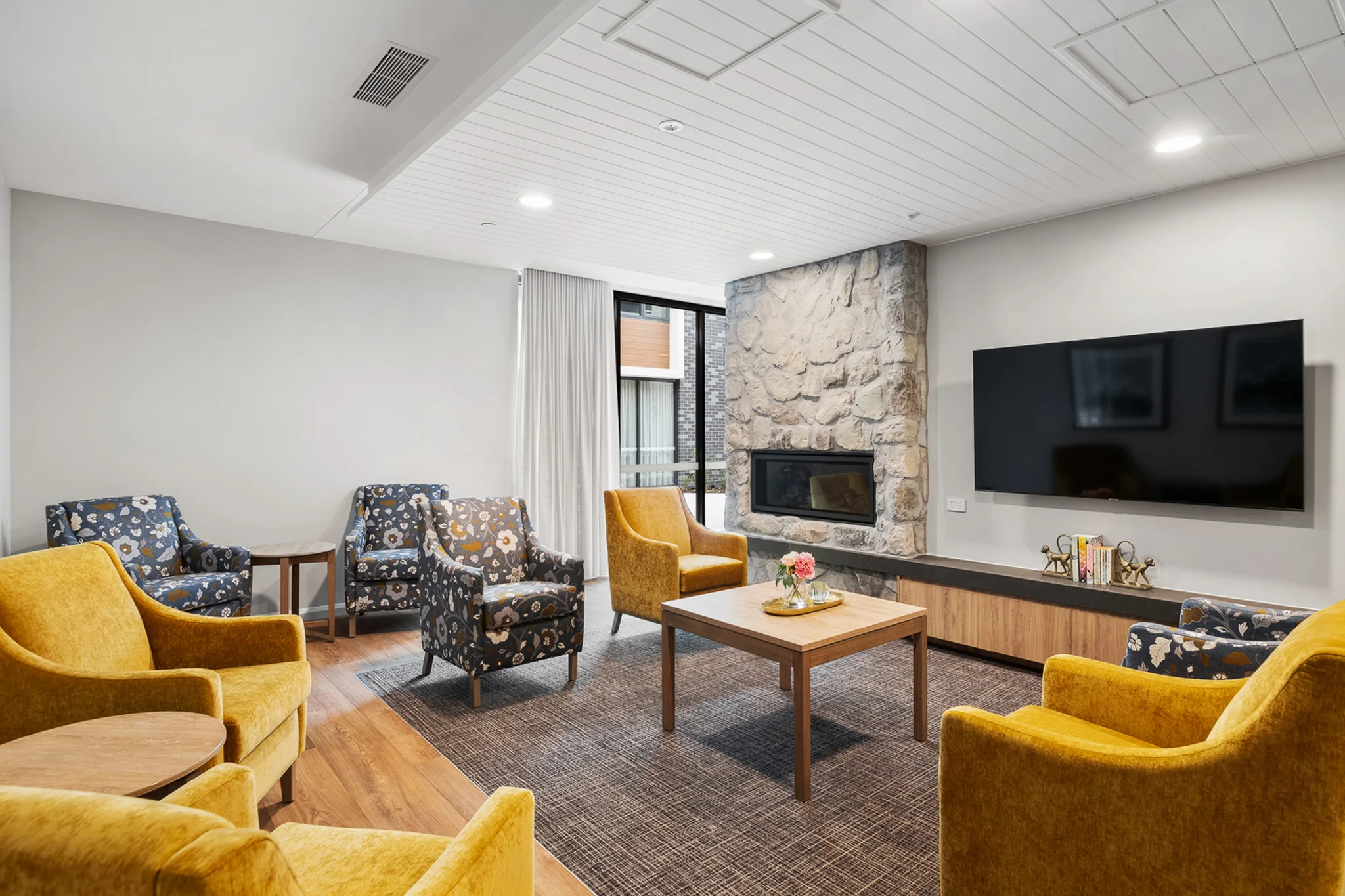 mayflower aged care melbourne resident lounge fireplace