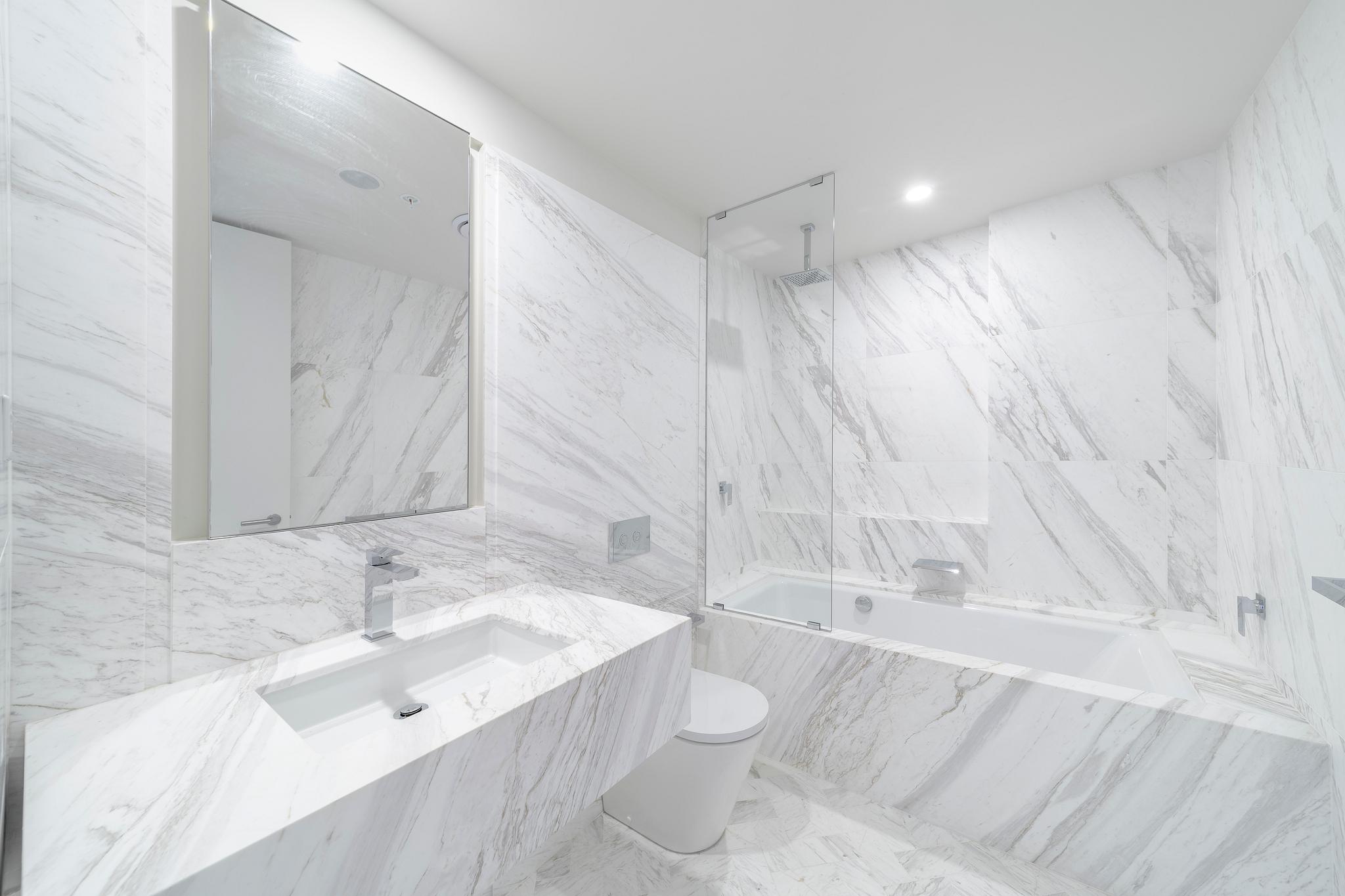 Modern accommodation bathroom fitout by Infinity Constructions