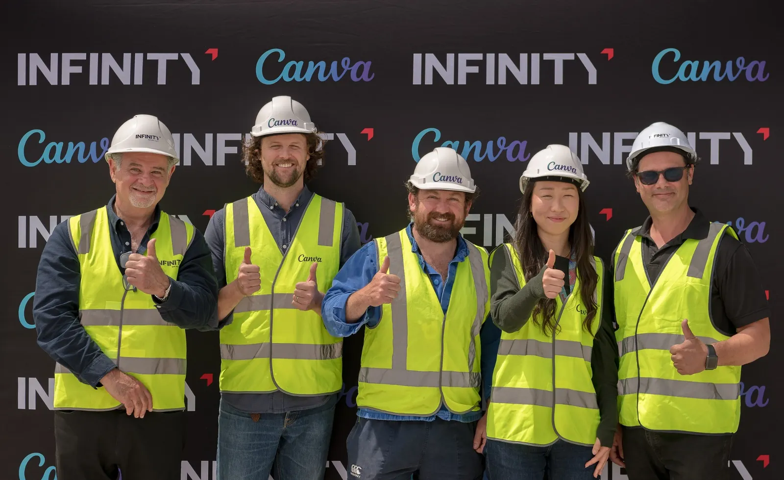 Canva and Infinity Constructions project partners photographed together during the topping out ceremony